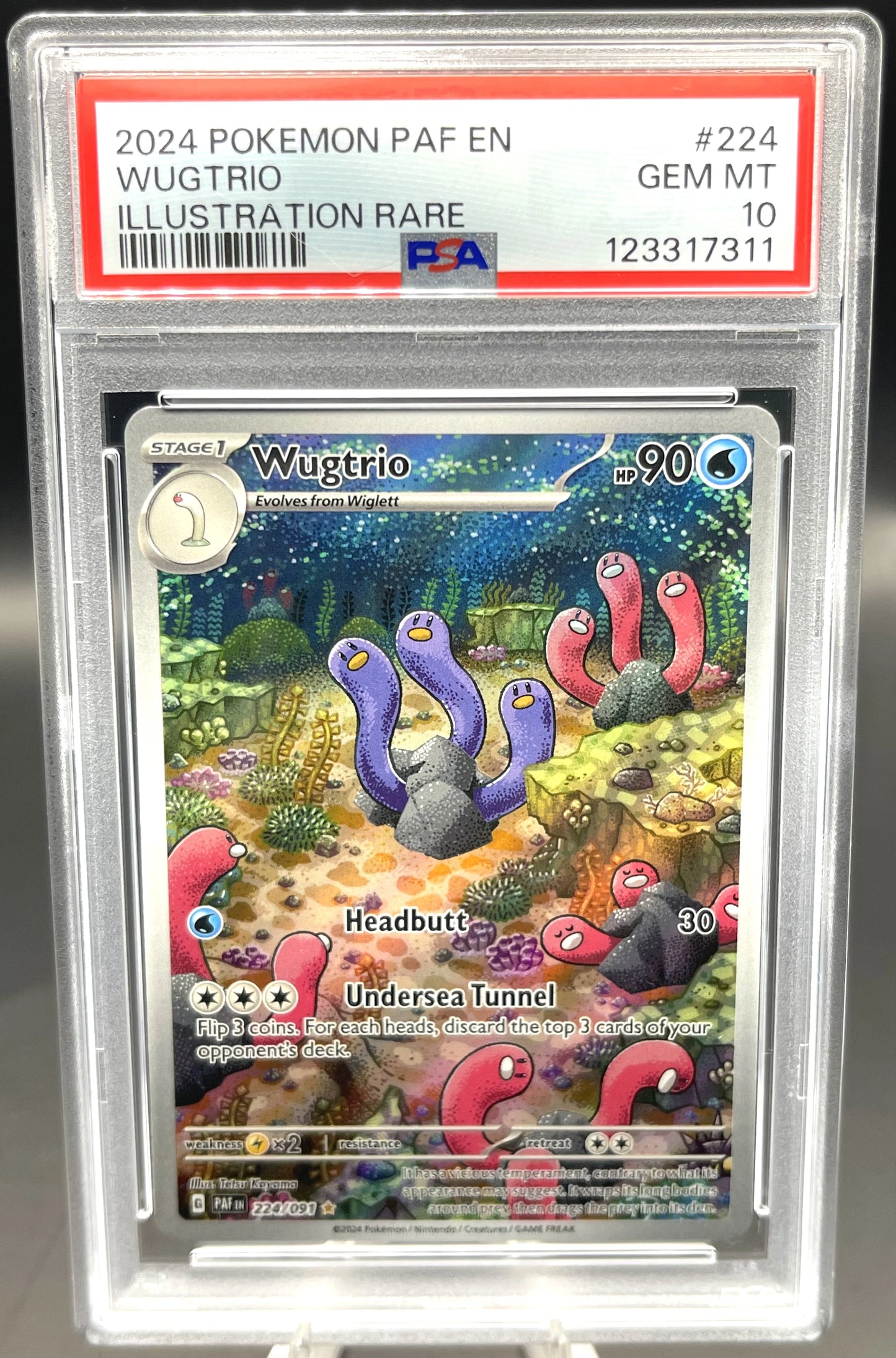 Pokémon trading card featuring Wugtrio in a protective case with PFA certification.