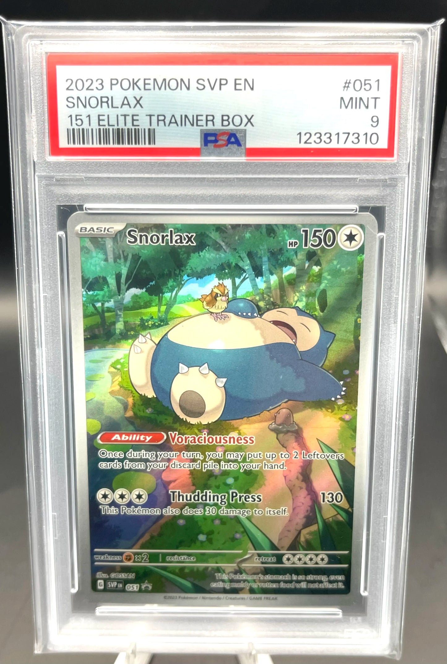 Pokémon trading card featuring Snorlax in a protective case with a PSA label.