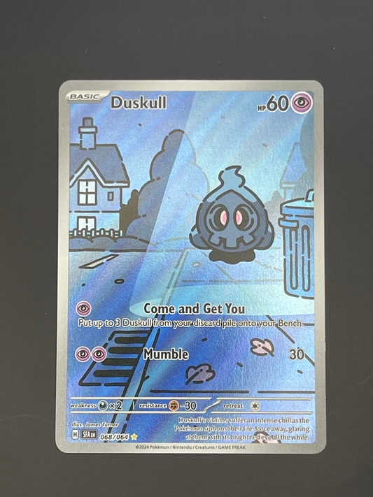 Pokémon trading card featuring Duskull on a dark background